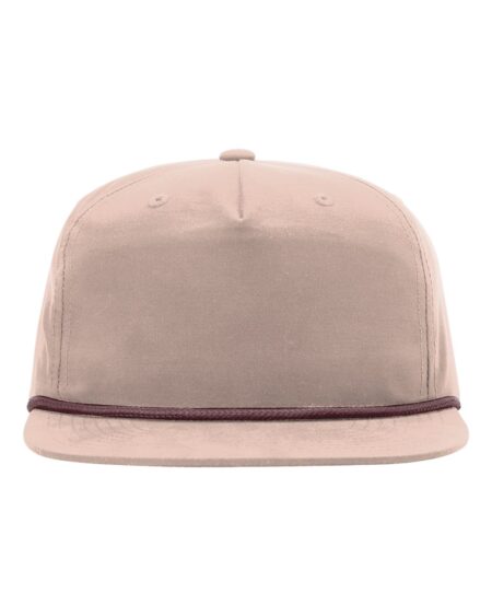 Front view of a pale peach flat-bill cap with a dark rope braid