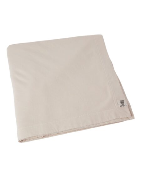 Garment-dyed fleece dorm blanket shown in ivory