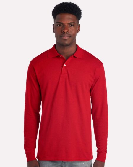 Model wearing a red JERZEES 437LR long sleeve polo shirt
