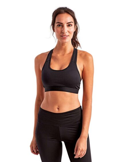 Front view of a woman wearing the black TriDri TD920 sports bra