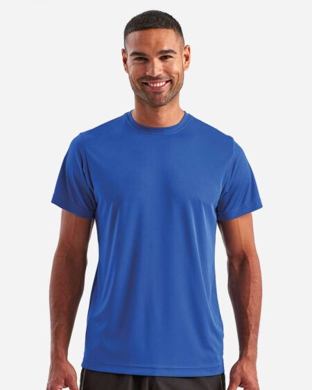 Front view of a model wearing the blue TriDri TD501 performance t-shirt