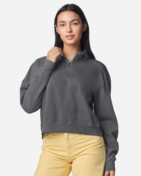Model wearing a dark gray women's quarter-zip sweatshirt